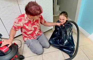 Vacuum-packed children?  Well, at least there's plenty of adult supervision, and this one is smiling!